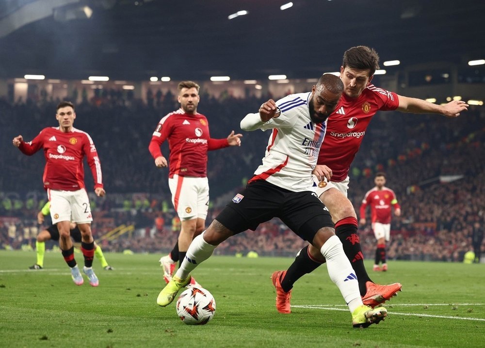 alexander-lacazette--l--and-harry-maguire-of-manchester-united--r--in-action-during-the-uefa-europa-league-quarter-finals-2nd-leg-soccer-match-between-manchester-united-and-olympique-lyonnais--efe